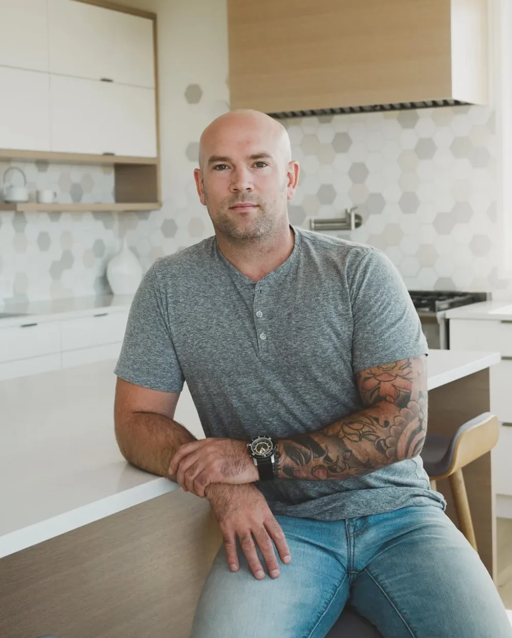 Adam Fryatt sitting at kitchen island