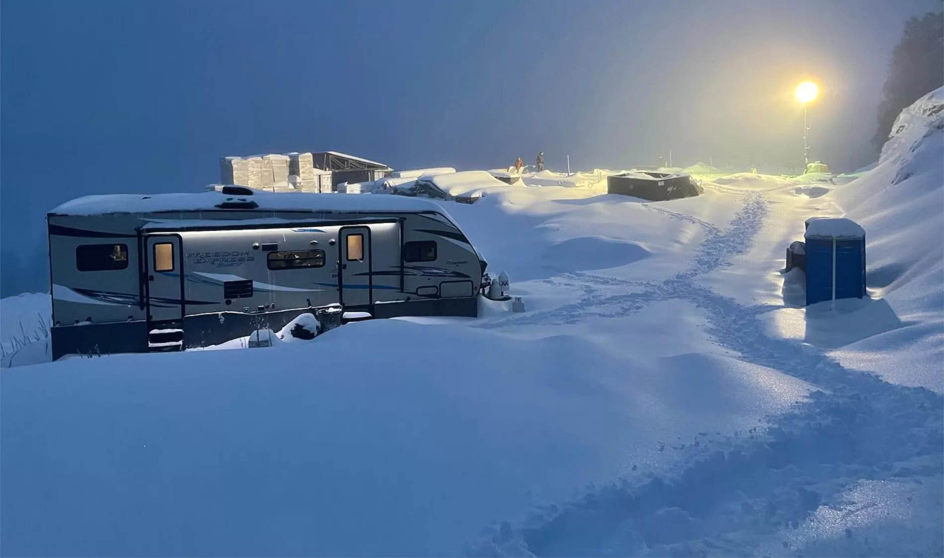 MDRN Built's trailer on Mt. Tuam, covered in snow at night time